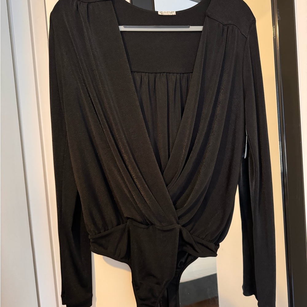 Never worn NWT Black Free People body suit size L